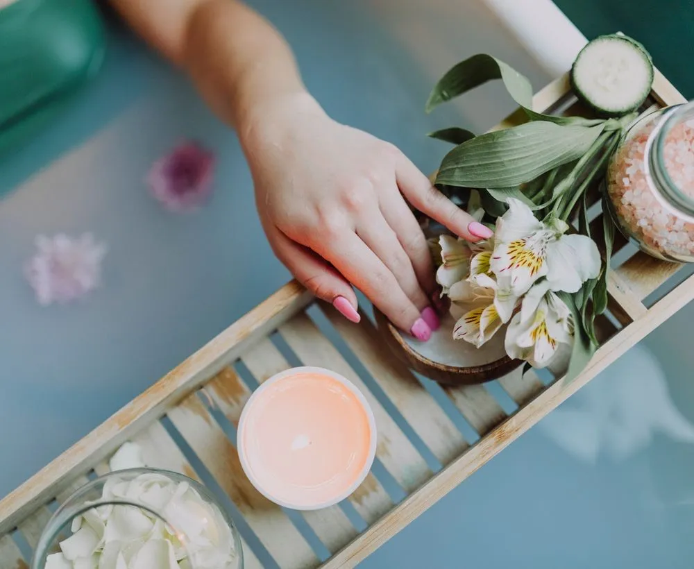 Calm spa setting — flowers, candles and natural touches