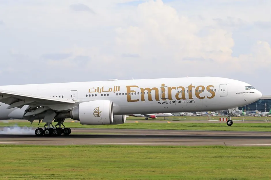 An Emirates aircraft parked at Dubai International Airport