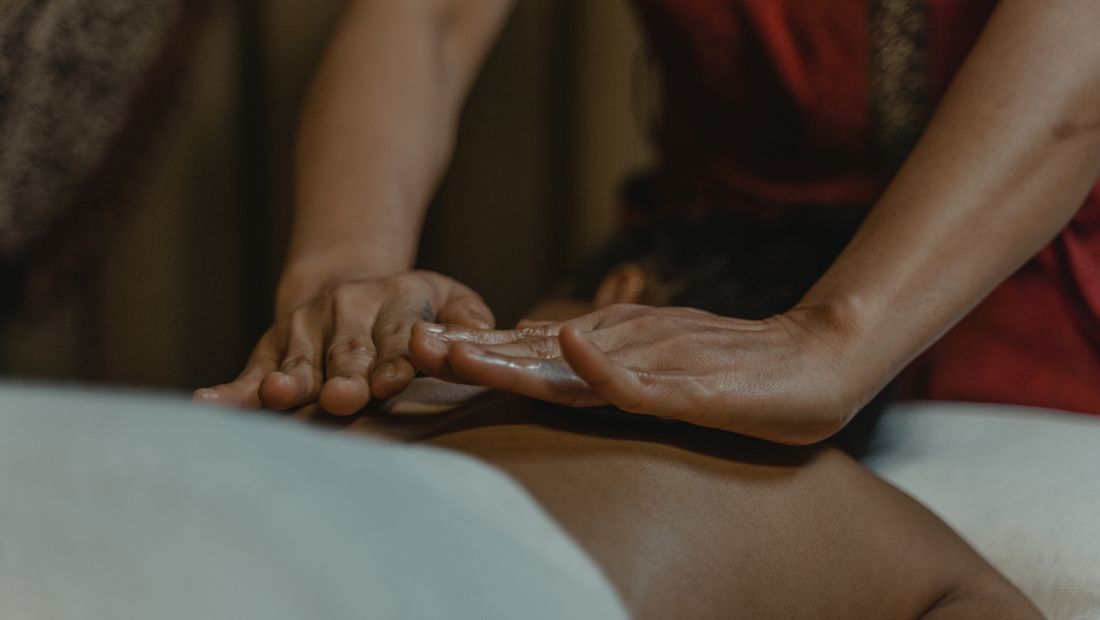 A professional massage on a portable table set up at home in Dubai